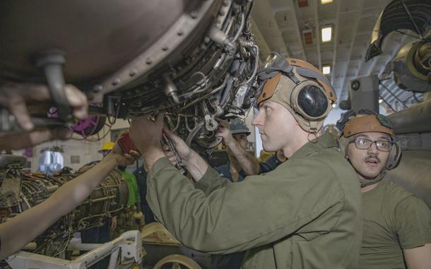  Cpl. Steven Adler adjusts bolts on an MV-22B engine on the USS Bataan on Feb. 9, 2020.