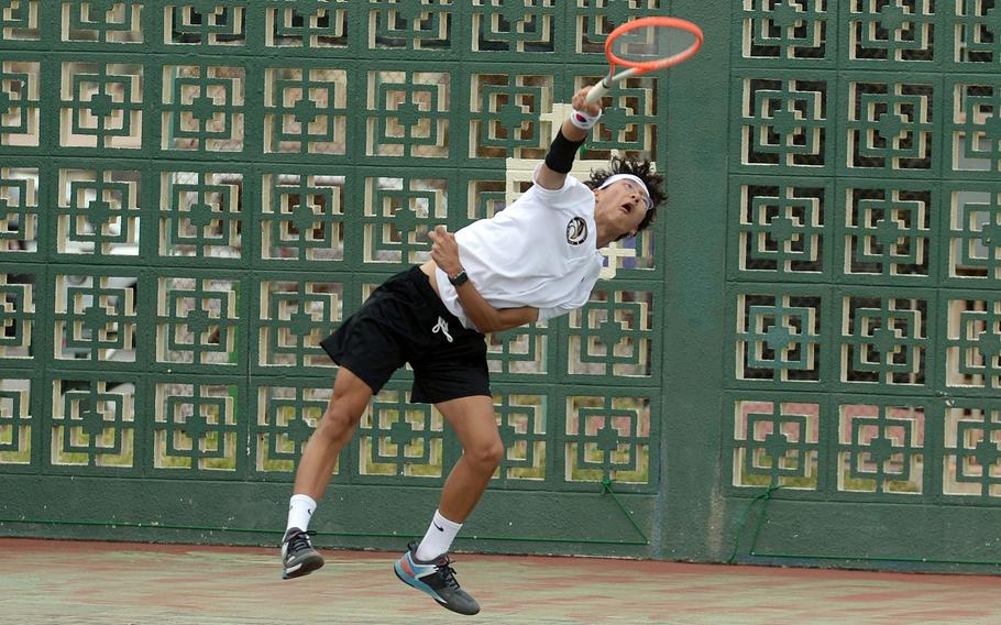 Humphreys' Dylan Byun serves during Thursday's action in the Far East tennis tournament. Byun teamed with Erin Ji to win the mixed doubles in two sets over Kubasaki's Jacy Fisk and Lan Legros.