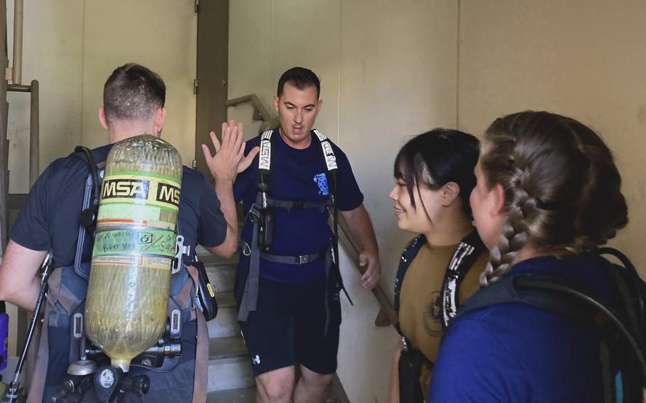 Two married couples, Team Spinstra, from left, Air Force Staff Sgt. Mark Williams, Senior Master Sgt. Manuel Campos, Marina Williams and Christine Campos, took part in a 9/11 stair climb at Yokota Air Base, Japan, on Sept. 11, 2023.