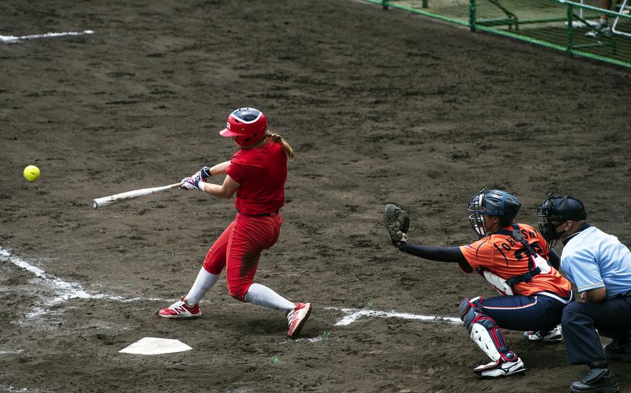 Haylie McCleney, an outfielder for the U.S. Women’s Olympic softball team, hits a line drive during an exhibition game against the Hitachi Sundivas in Iwakuni, Japan, Monday, July 12, 2021. 