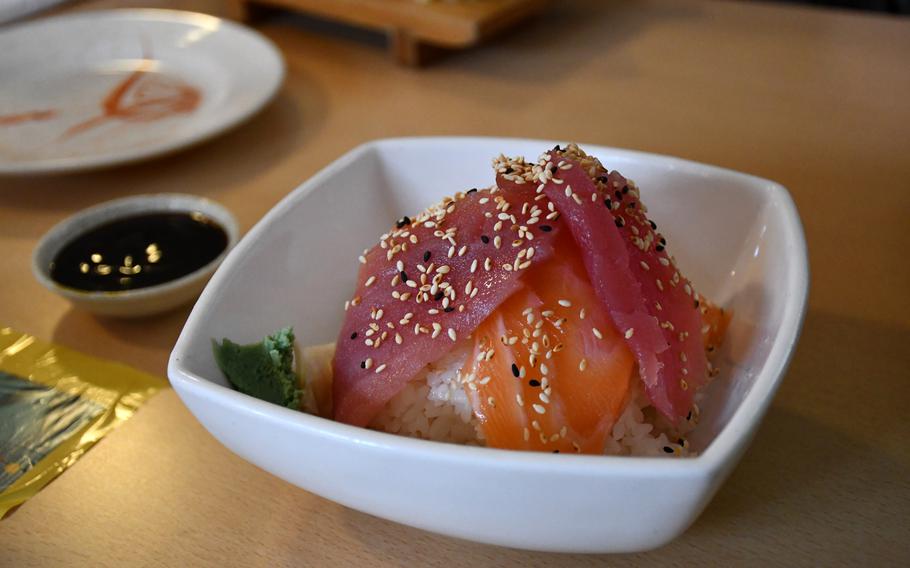 The sashimi salmon and tuna don on a bed of white rice at Sakura in Lakenheath, England.