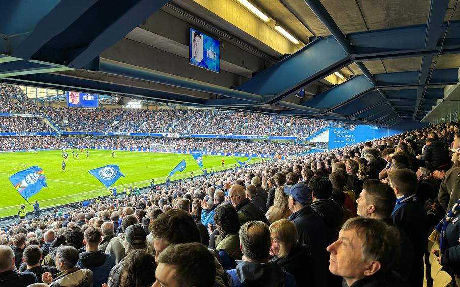 Supporters of Chelsea Football Club take in the action as the hometown team battles Leicester City in the FA Cup quarterfinal at Stamford Bridge, London, on March 17, 2024. 