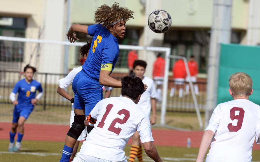 Yokota's Braedan Raybon heads the ball over Matthew C. Perry's Zach Cruz and Jalen Cooley during Friday's Perry Cup boys soccer match. The Panthers won 2-1.