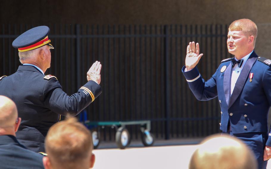 Tanner Johnson is sworn in as a U.S. Space Force officer by his grandfather, retired Army Lt. Col. Terry Johnson, at a ceremony at the U.S. Air Force Academy in Colorado Springs, Colo., May 25, 2021. A year earlier, Tanner Johnson was diagnosed with Type 1 diabetes and was told his military career was over.