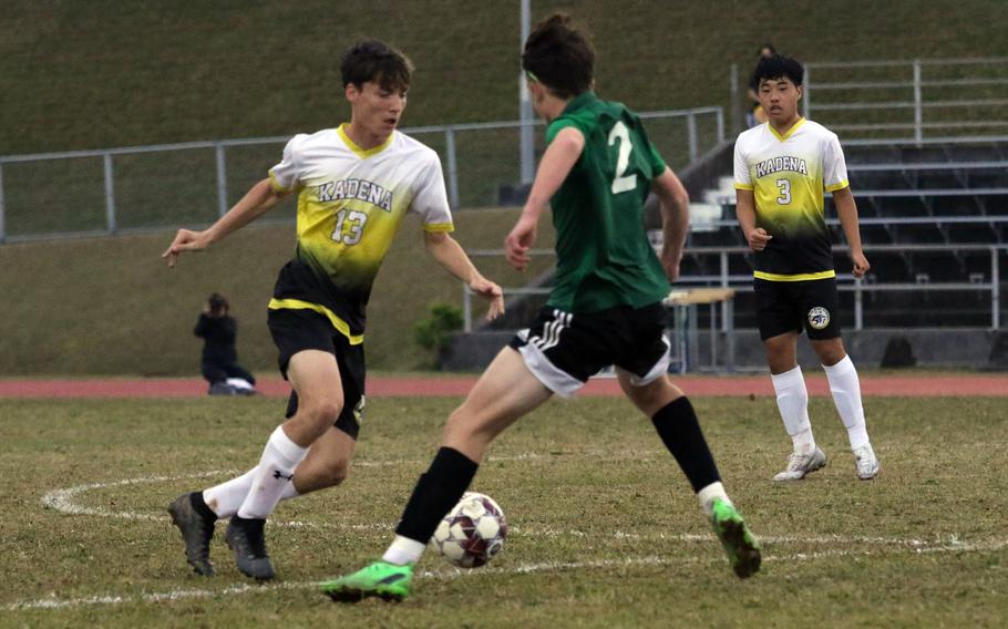 Kadena's Evan Davis dribbles against Kubasaki's Luca Lantz during Wednesday's Okinawa boys soccer match. The Panthers won 3-2.