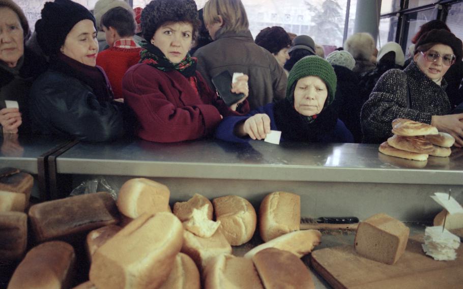 Several women wait with their tickets in hand, for fresh bread at a bakery in Moscow, Monday, Dec. 23, 1991. 