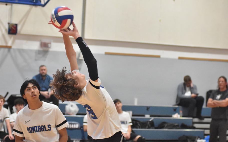 Rota's Tyler DeMeritt sets the ball backwards over the net in the Admirals' semifinal loss to Black Forest Academy on Friday, Oct. 28, 2022.

Kent Harris/Stars and Stripes