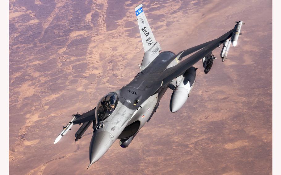 An Air Force F-16 Fighting Falcon aircraft assigned to the 121st Expeditionary Fighter Squadron flies over U.S. Central Command’s area of responsibility on July 17, 2021, during a mission in support of Combined Joint Task Force-Operation Inherent Resolve.