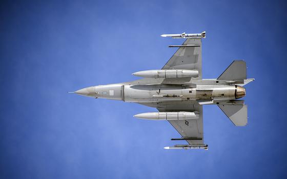 Colonel Julien Clay, pilot of the F-16 Fighting Falcon, flies his final flight past onlookers at Buckley Air Force Base, Colo., May 5, 2015. (U.S. Air National Guard photo by Senior Master Sgt. John P. Rohrer/Released)