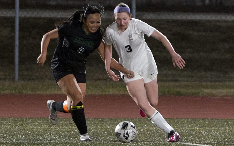 Amber Baltazar and Maisey Throop vie for control of the ball.