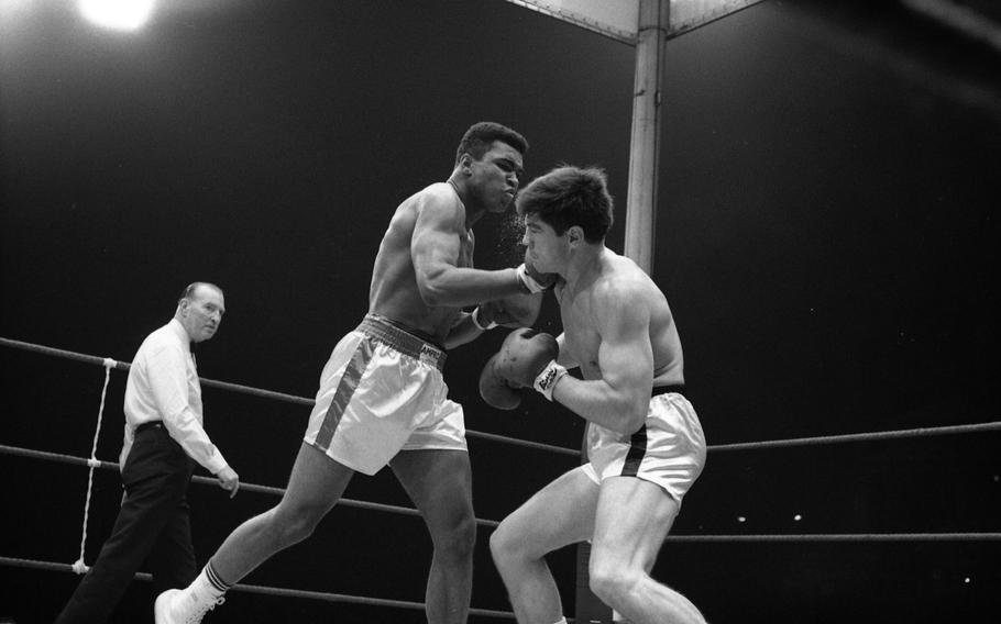 Muhammad Ali’s right fist connects with German boxer Karl Mildenberger in the ring at the Waldstadion in Frankfurt, Germany, on Sept. 10, 1966. 