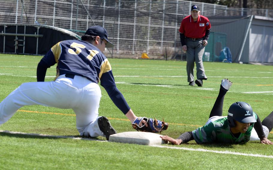 Kubasaki’s Luka Koja dives back to first ahead of the tag by St. Mary’s Raku Kodai, The Dragons won 6-4.