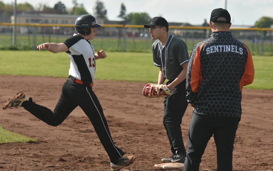 Wiesbaden senior first baseman Sergio Egland tags out Spangdahlem catcher Andre Danielson at first base during Game One of a doubleheader in Wiesbaden, Germany on April 20, 2024.