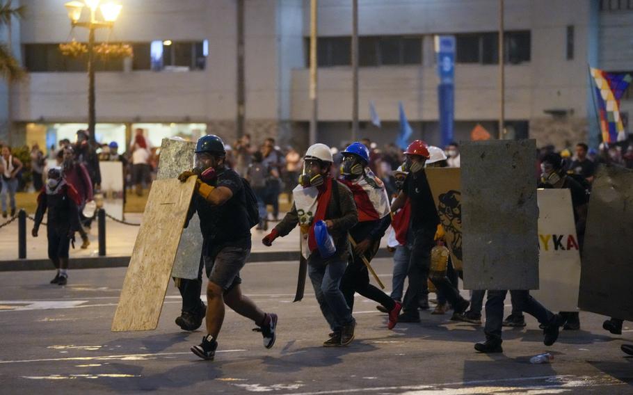 Antigovernment protesters clash with police in Lima, Peru, Tuesday, Jan. 24, 2023. Protesters are seeking the resignation of President Dina Boluarte, the release from prison of ousted President Pedro Castillo, immediate elections and justice for demonstrators killed in clashes with police. 