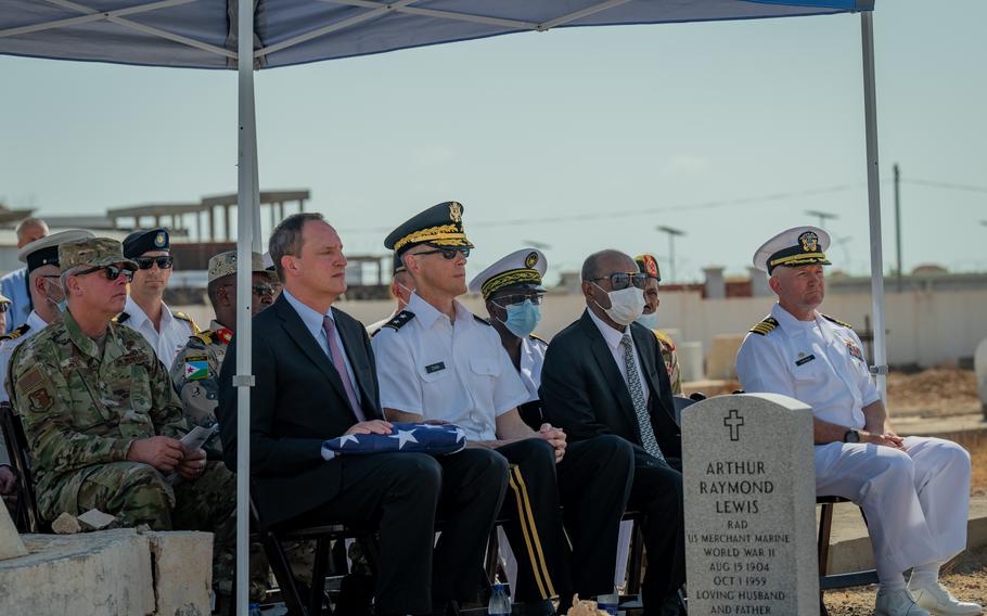 From left, Jonathan Pratt, U.S. ambassador to Djibouti, and Maj. Gen. William Zana, Combined Joint Task Force-Horn of Africa commander, attend a burial ceremony in honor of Coast Guard veteran and WWII U.S. Merchant Marine Arthur Lewis at the New European Cemetery in Djibouti city, Djibouti, Oct. 28, 2021. Joint Task Force members rededicated the site for Lewis, who died at sea and was buried without military honors in 1959.