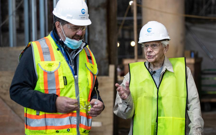 Michigan Central construction manager Richard Bardelli, left, guides George England for a tour inside Michigan Central Station in Detroit on Sept. 25, 2021.