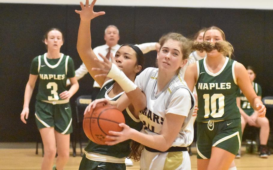 Naples’ Guils Pablo and Vicenza’s Ivy McLeod battle for a rebound Friday, Feb. 2, 2024, in the Wildcats’ 34-32 victory over the Cougars.