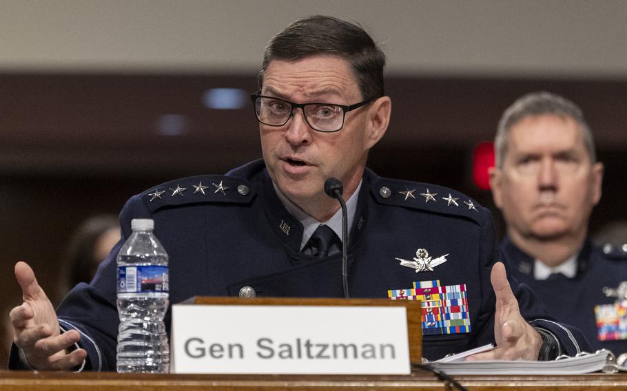 Saltzman, in uniform, testifies.
