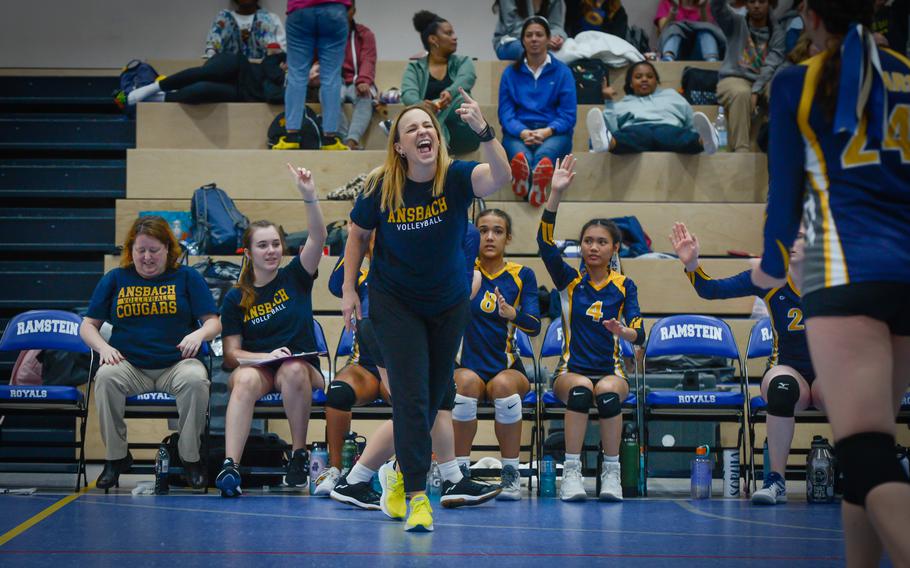 Ansbach coach Deb Keller-Mitchell cheers as her team closes in on a win against Sigonella during the 2022 DODEA-Europe Volleyball Tournament Oct. 29, 2022, at Ramstein Air Base, Germany. Her team bested Sigonella in three sets for the Division III championship.