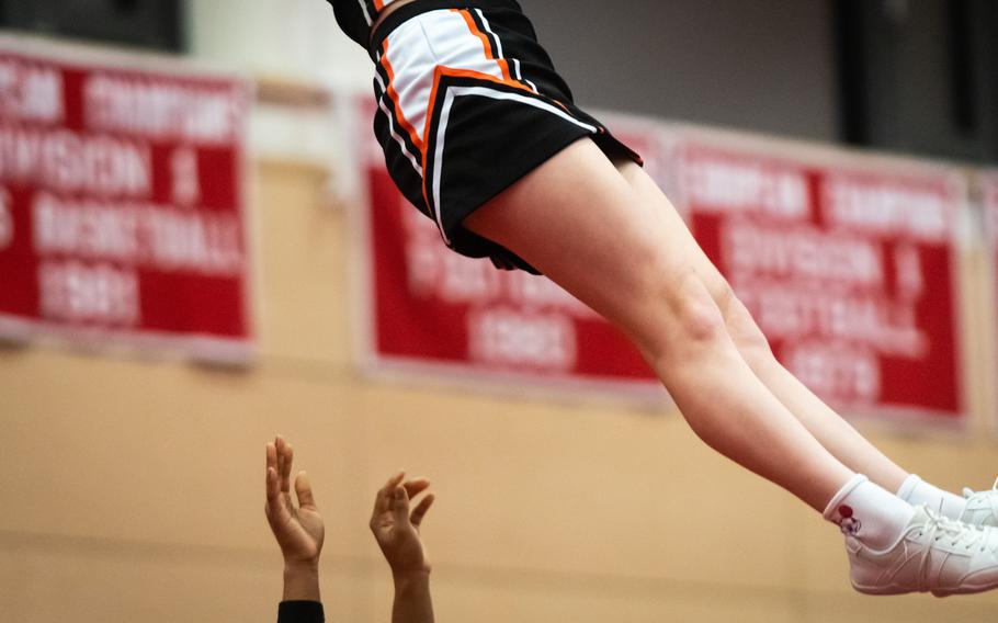 The Spangdahlem cheer team performs a stunt at the 2023 DODEA-Europe Cheerleading Championships at Kaiserslautern High School on Friday, Feb. 18.