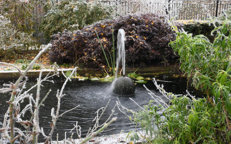 A water fountain in the middle of a manmade pond at the Abbey Gardens in Bury St. Edmunds, England, Dec. 13, 2022. The Abbey Gardens has over 400 rose bushes and locations where visitors can sit and view the sites around them.  