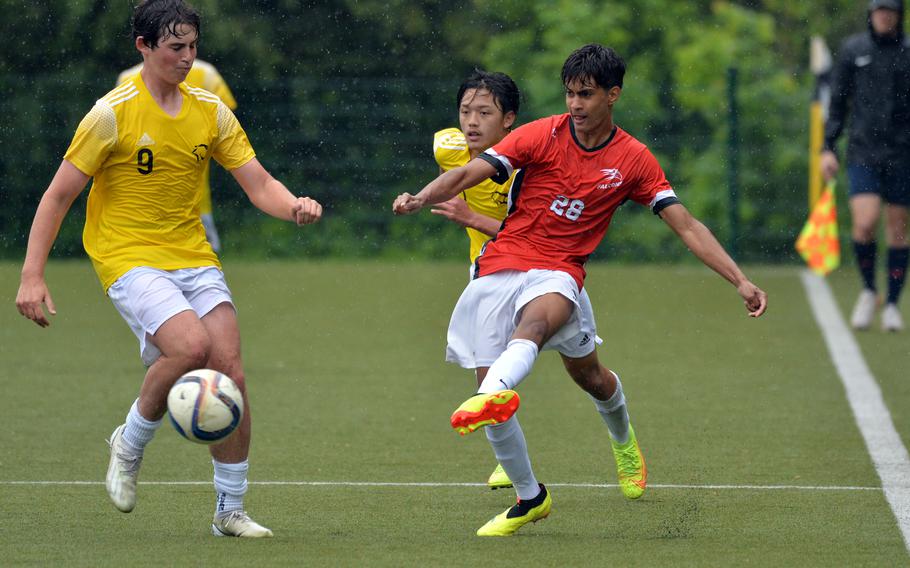AOSR’s Rayan Ranieri centers the ball against Vicenza’s Tyler Holt in a Division II game won by AOSR 3-1, at the DODEA-Europe soccer finals at Reichenbach-Steegen, Germany, May 21, 2024. 