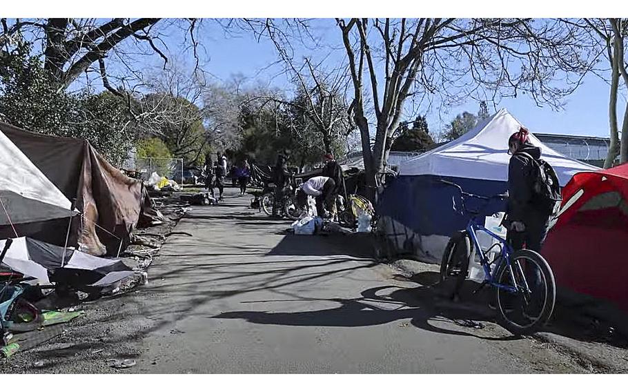 A video screen grab shows a homeless encampment along the Joe Rodota Trail in Santa Rosa, Calif.