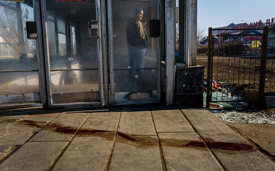 A pool of blood is streamed in front of the entrance to the subway in the Moskovskyi district of Kharkiv, Ukraine, on Friday, March 25, 2022.