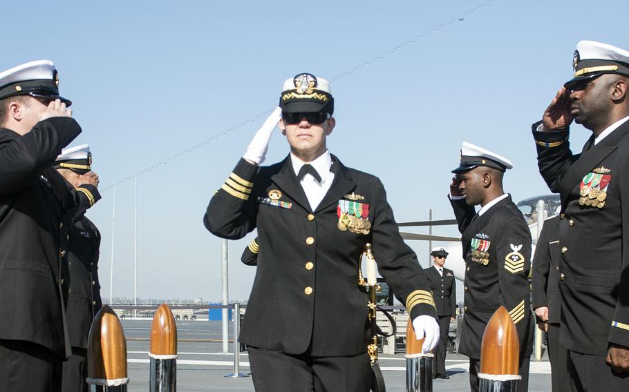 Then-Cmdr. Danielle DeFant salutes at a change of command ceremony in San Diego, Calif., Dec. 1, 2017. Defant, now a captain, was relieved of command of the cruiser USS Lake Erie in October 2023. A Navy investigation report determined that DeFant had bullied her crew and created a toxic command climate.