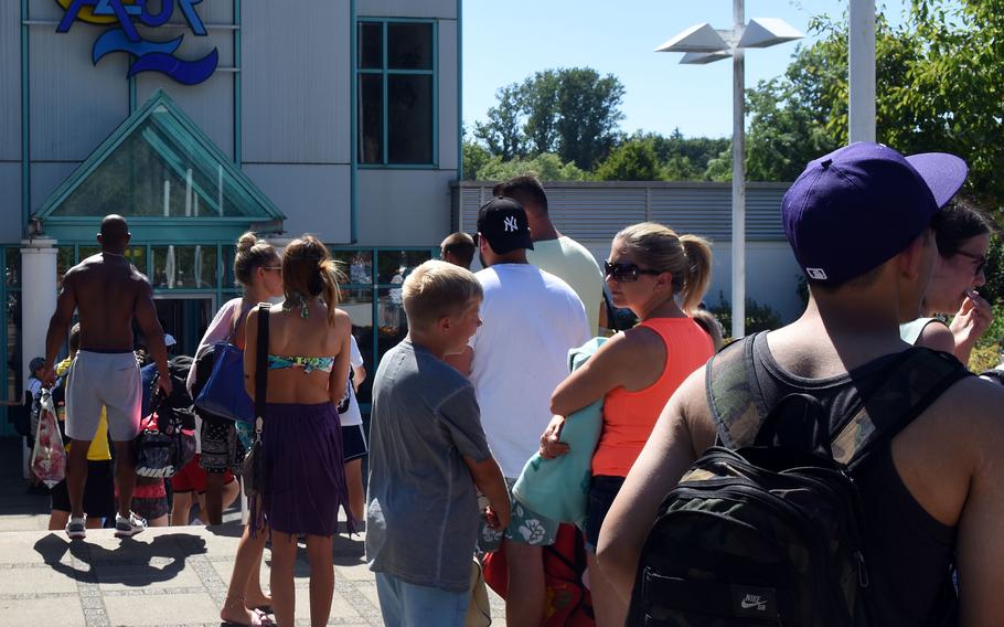 The line to get into the Azur swimming pool near Ramstein Air Base, Germany, was long Tuesday, July 19, 2022, during what was the hottest day Germany has recorded this year. A heat wave has hit much of Europe, with U.S. bases coping by curtailing physical activity and work schedules in some places. 