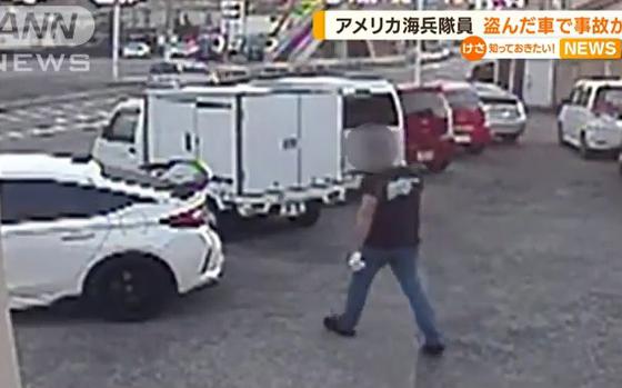 This screenshot from an All Nippon News report shows security camera footage from a car dealer in Iwakuni, Japan, Dec. 3, 2022.