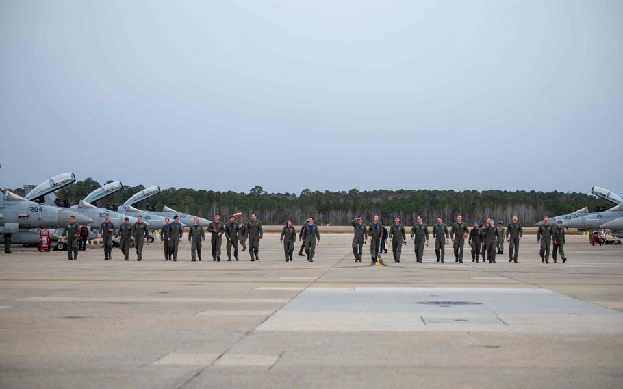 Aviators assigned to Strike Fighter Squadron (VFA) 213, “Blacklions,” walk on the flightline after their homecoming flight to Naval Air Station Oceana, Jan. 15, 2024.