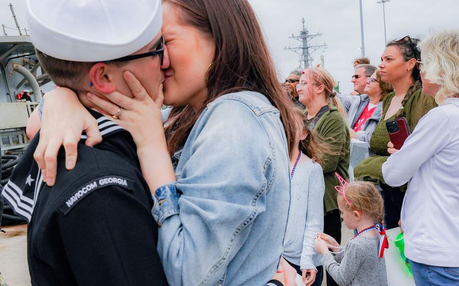 Petty Officer 3rd Class Brett Roberson shares the first kiss with his wife, Cryslyn, after the destroyer USS Ramage returned to its homeport at Naval Station Norfolk, Va., Dec. 3, 2023. It was deployed for seven months to the U.S. Naval Forces Europe area of operations.