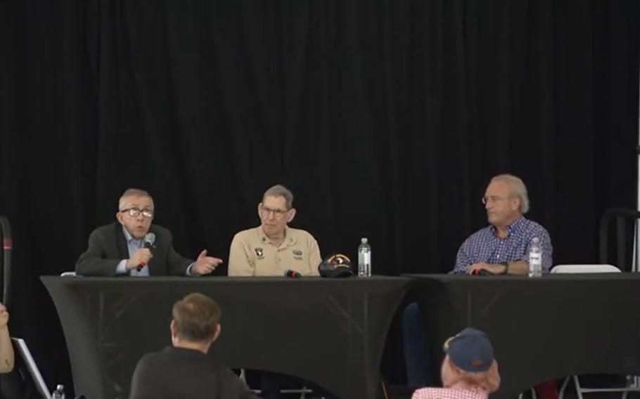 In this video screenshot, journalists John Olson, left, and Calvin Posner discuss their experiences covering the Vietnam war with moderator Mark Bowden at a panel hosted by Stars and Stripes as part of the Vietnam War 50th Year Commemoration in Washington in May.