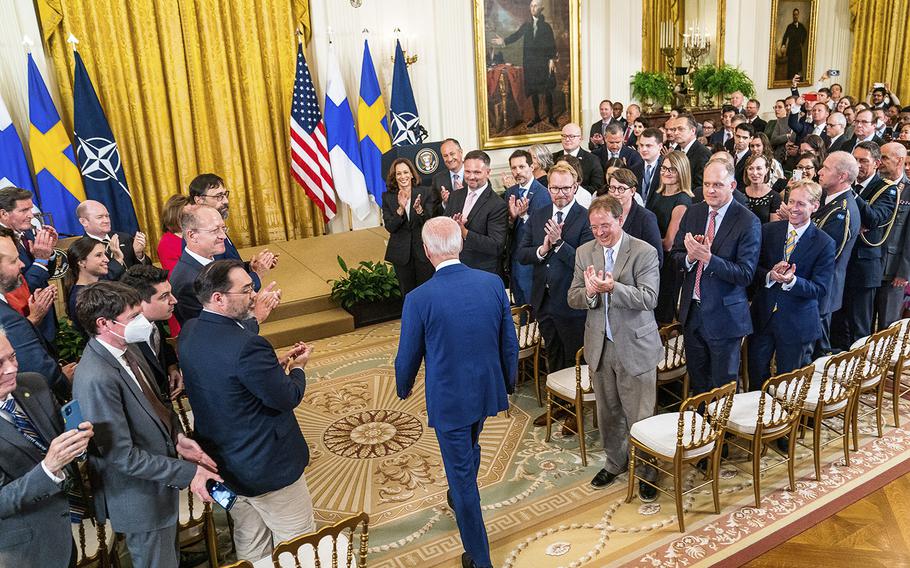 President Biden arrives in the East Room of the White House on Aug. 9, 2022, to sign documents starting the process of admitting Finland and Sweden to NATO. 