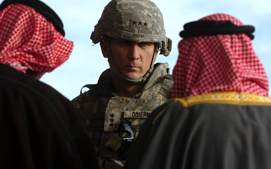 Lt. Gen. Raymond Odierno, commander of Multi-National Corps-Iraq, speaks with a group of local sheiks at Patrol Base Kemple, Dec. 18, 2007. Odierno, a four-star Army general who was a key architect of the “surge” in U.S. forces during the Iraq War that was credited with reducing violence and increasing stability in the country and who later became the Army’s chief of staff, died Oct. 8, 2021, at age 67.