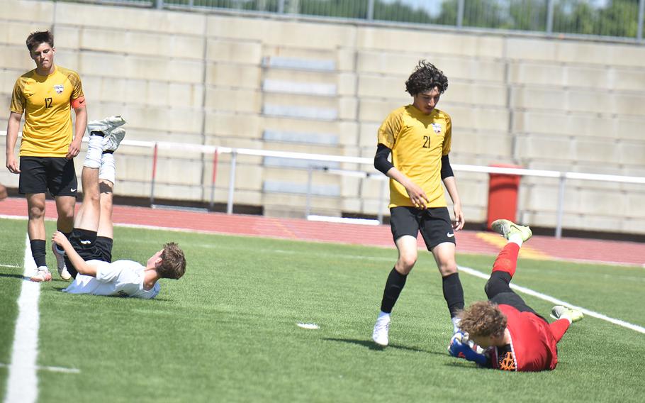 Kaiserslautern goalkeeper Finn Derby grabs the ball before Stuttgart's James Sheppard can get to it Tuesday, May 20, 2025, at the DODEA-Europe Division I boys soccer championships in Kaiserslautern, Germany.