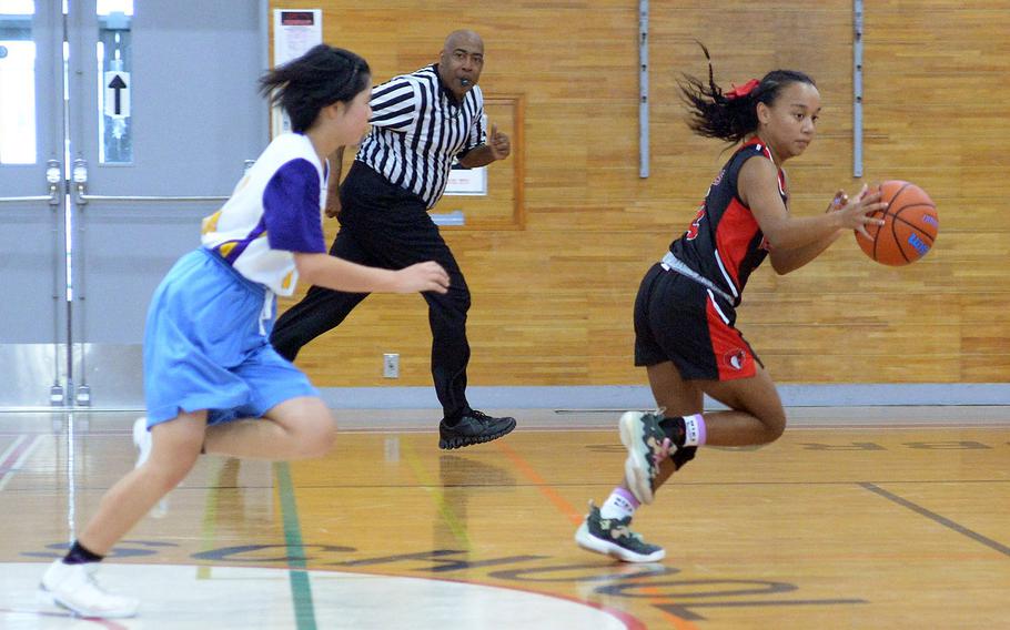 E.J. King's Miu Best leaves a Sasebo North defender in her wake as she dashes upcourt during Saturday's Japan girls basketball game. The Cobras won 65-38.