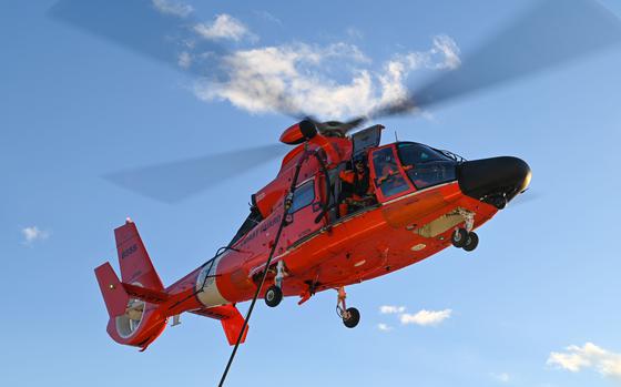 A U.S. Coast Guard Helicopter Interdiction Tactical Squadron MH-65 Dolphin helicopter crew conducts training with USCGC Stone (WMSL 758) in the Atlantic Ocean, Jan. 14, 2023. Stone is on a scheduled multi-mission deployment in the South Atlantic to counter illicit maritime activities and strengthen relationships for maritime sovereignty throughout the region. (U.S. Coast Guard photo by Petty Officer 3rd Class Riley Perkofski)