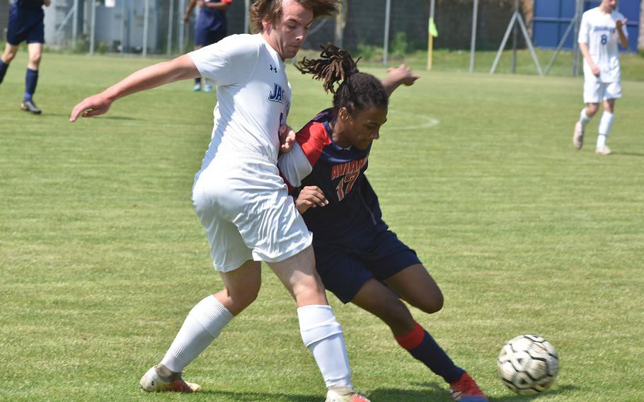 Sigonella's Paul Becker and Aviano's Deon Walker battle for the ball Saturday, April 30, 2022 in Aviano, Italy.