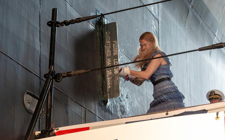 Ship sponsor Larissa Thune Hargens executedsthe ceremonial bottle break over the bow of Pierre on Saturday, May 18, 2024, in Mobile, Ala.
