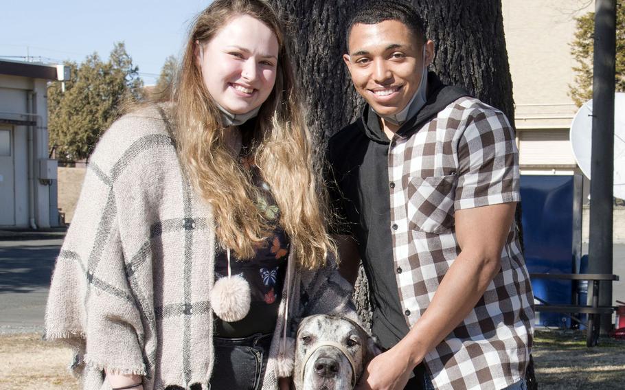 Senior Airman Avaunte Frizzell and spouse Josie Hayward pose with Henry, their 145-pound Great Dane, at Yokota Air Base, Japan, Jan. 22, 2022.