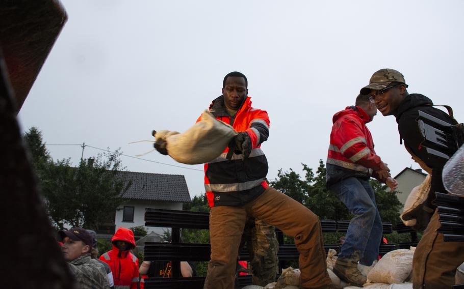 Members of the 52nd Civil Engineer Squadron from Spangdahlem Air Base, Germany, lay sandbags in Binsfeld, Germany, July 14, 2021. 