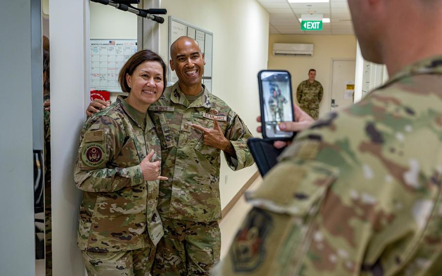 Chief Master Sgt. of the Air Force JoAnne S. Bass poses with an airman during her visit to Al Dhafra Air Base, United Arab Emirates, March 24, 2022. Bass and her public affairs team are prolific users of social media, with more than  206,000 Facebook followers.