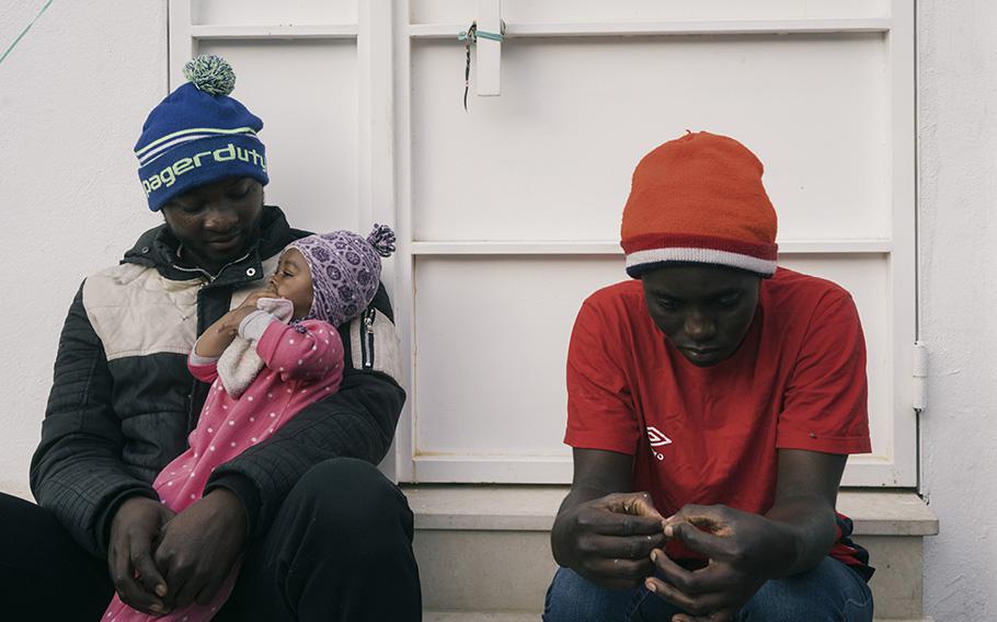 Married couple Aziz Turay, left, and Kadija Tokaba with their son in Tunis, Tunisia, on May 24, 2023. Turay, originally from Sierra Leon, says his family has been living in an encampment in Tunis since they were evicted from their apartment. 