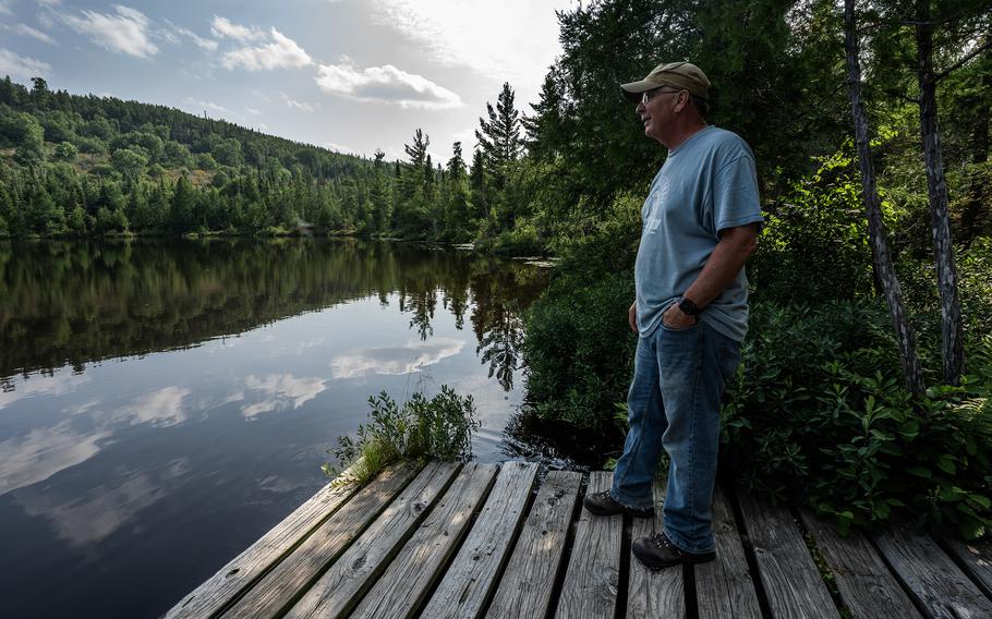 Gunflint Lodge co-owner John Frederickson looks out on Lonely Lake in Grand Marais, Minn., on July 28. 