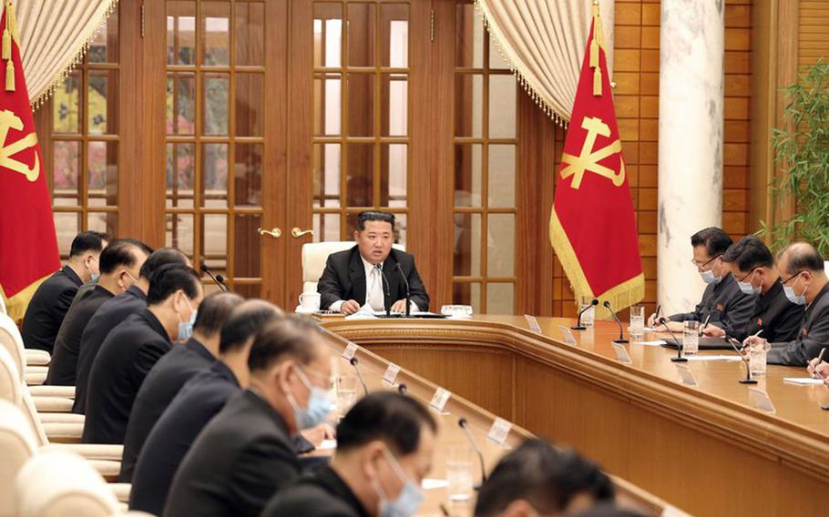 North Korean leader Kim Jong Un holds a meeting on the coronavirus in this undated image released by the state-run Korean Central News Agency on May 12, 2022.