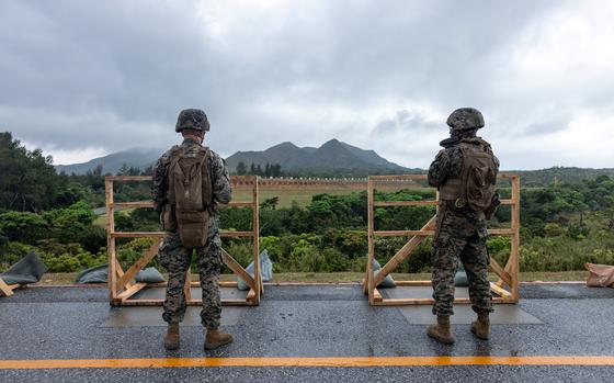 Marines shoot on barricades at a rifle range on Camp Hansen in Okinawa.