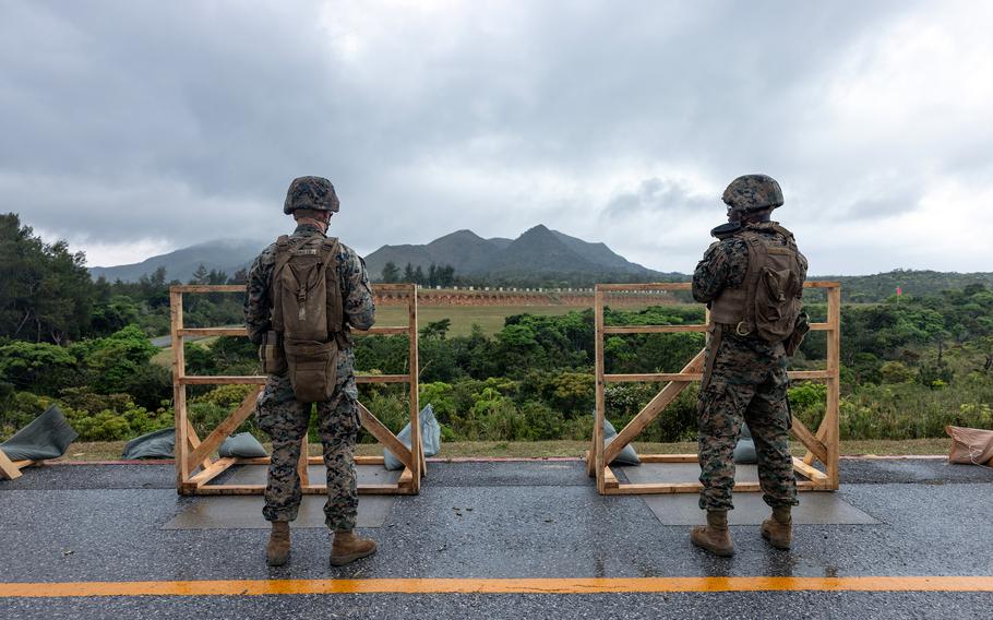 Marines shoot on barricades at a rifle range on Camp Hansen in Okinawa.