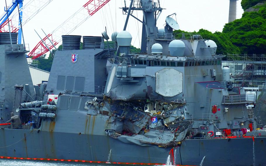 The guided-missile destroyer USS Fitzgerald, heavily damaged in collision with a merchant ship, docks at Yokosuka Naval Base, Japan, June 17, 2017. 